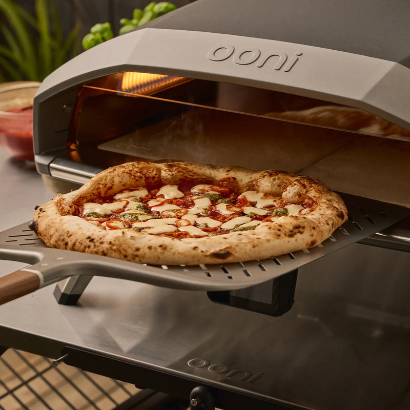 Load image into Gallery viewer, Ooni Signature Perforated Pizza Peel retrieval
