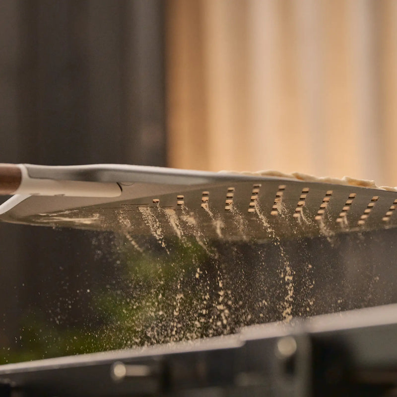 Load image into Gallery viewer, Ooni Signature Perforated Pizza Peel pizza prep
